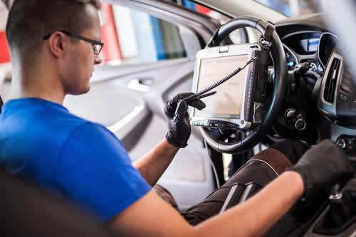tech doing a windshield calibration